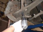 Disconnect strut rod from lower control arm